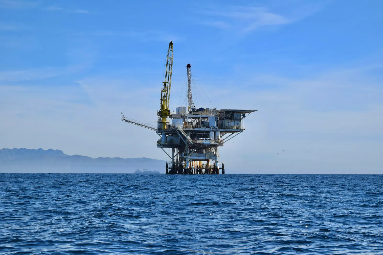A semisubmersible offshore platform undergoing conversion work at a yard