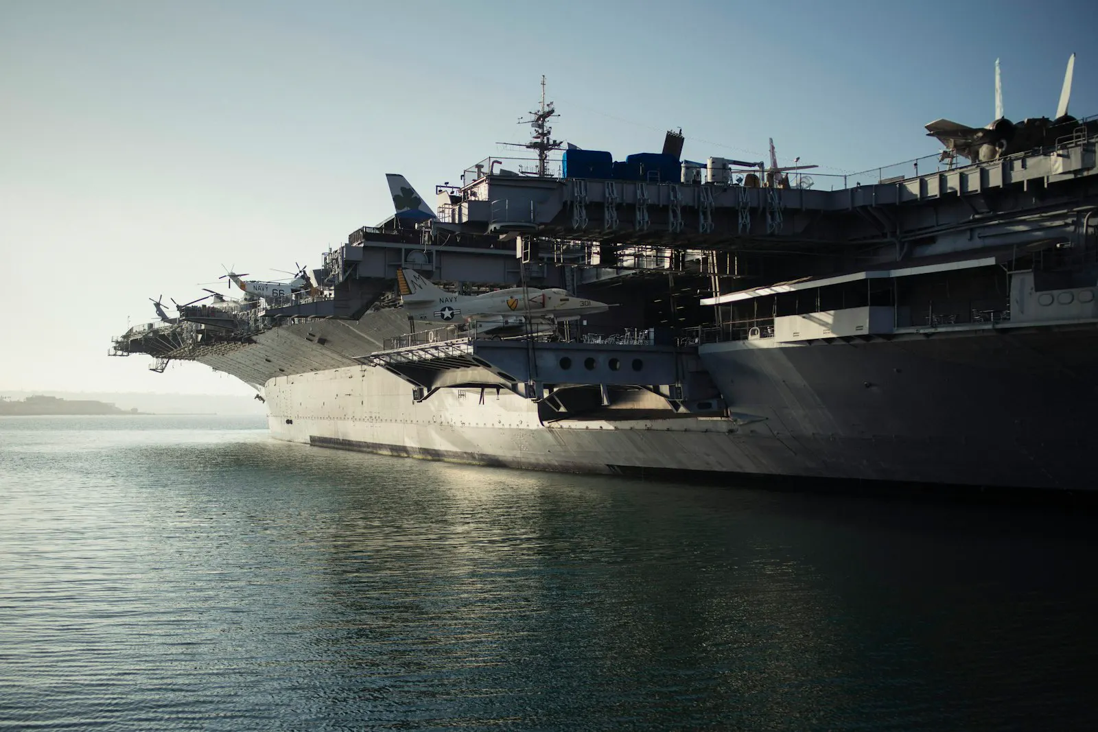 Aircraft carrier in a large naval dry dock